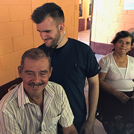 Students providing an exam to a patient