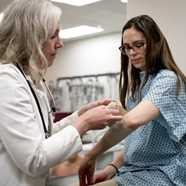 PA wrapping a patient's arm