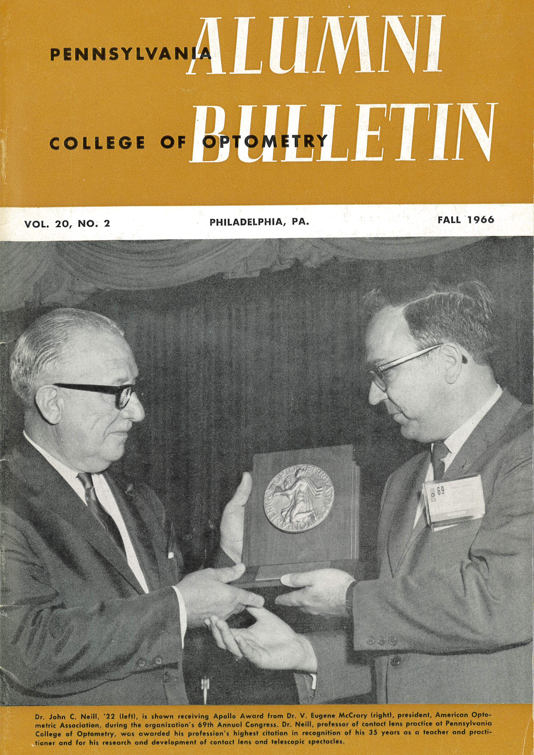 1966 Alumni Bulletin: Dr. John C. Neill, ’22 (left) is shown receiving the Apollo Award from Dr. V. Eugene McCrary (right)