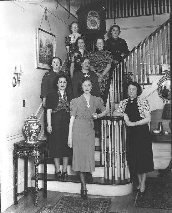 PCO female students on staircase with mrs fitch at fitch residence 1938