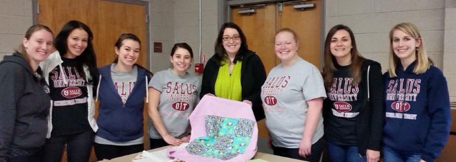 OT students with blanket for project linus