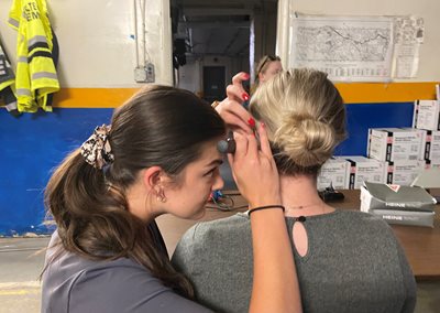 Audiology student conducts hearing screening