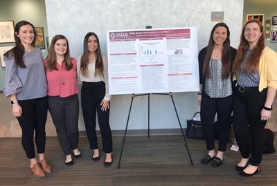 sarah gosnell and colleagues with poster