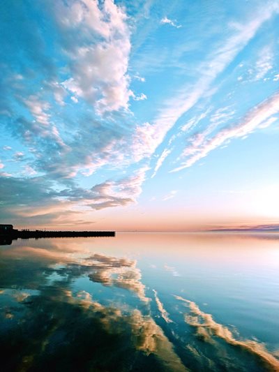 Blue sky over blue water