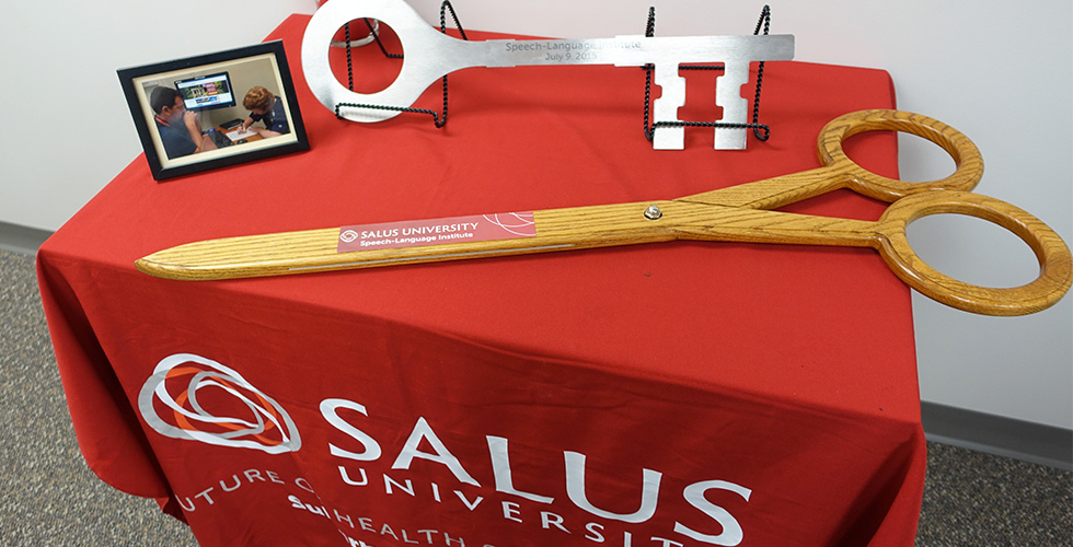 giant scissors and key on table