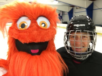 Stephanie Holt and a hockey mascot