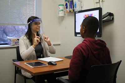 SLP student working with pediatric client