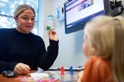 speech-language pathologist working with a pediatric client