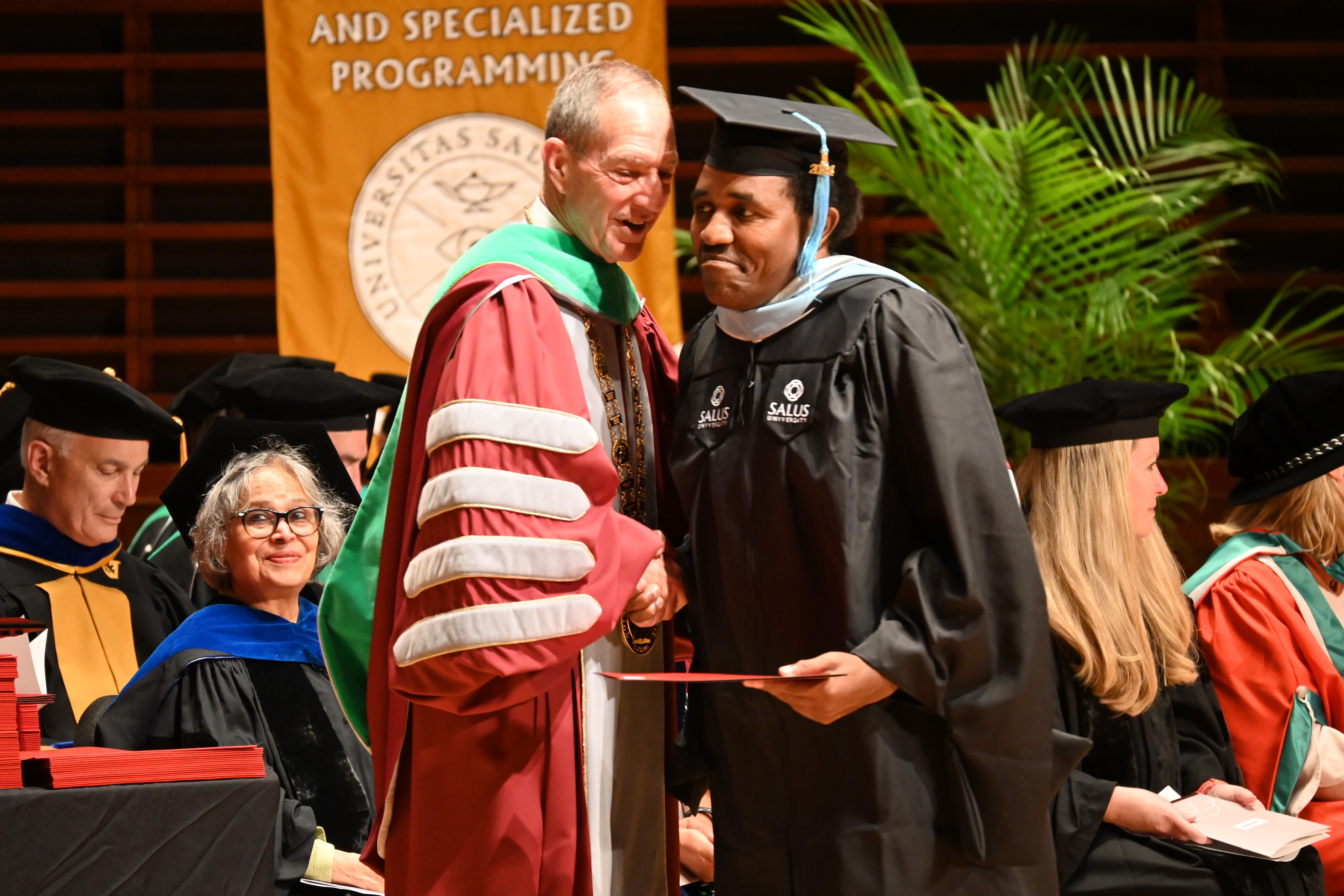 Dr. Mittelman congratulates graduate