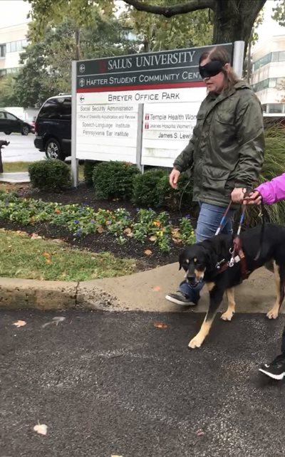 Sara Reuss walking with a Guide Dog