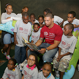 L.J. Smith reading to pediatric TEI patients