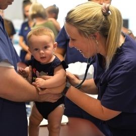 Physician assistant students with pediatric patient