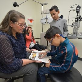 Dr. Matchinski working with child