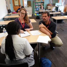 Two SLPs working with student