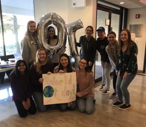 OT students group photo holding "OT" balloons