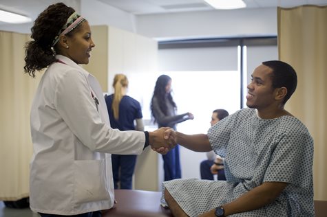 Clinician and patient shaking hands