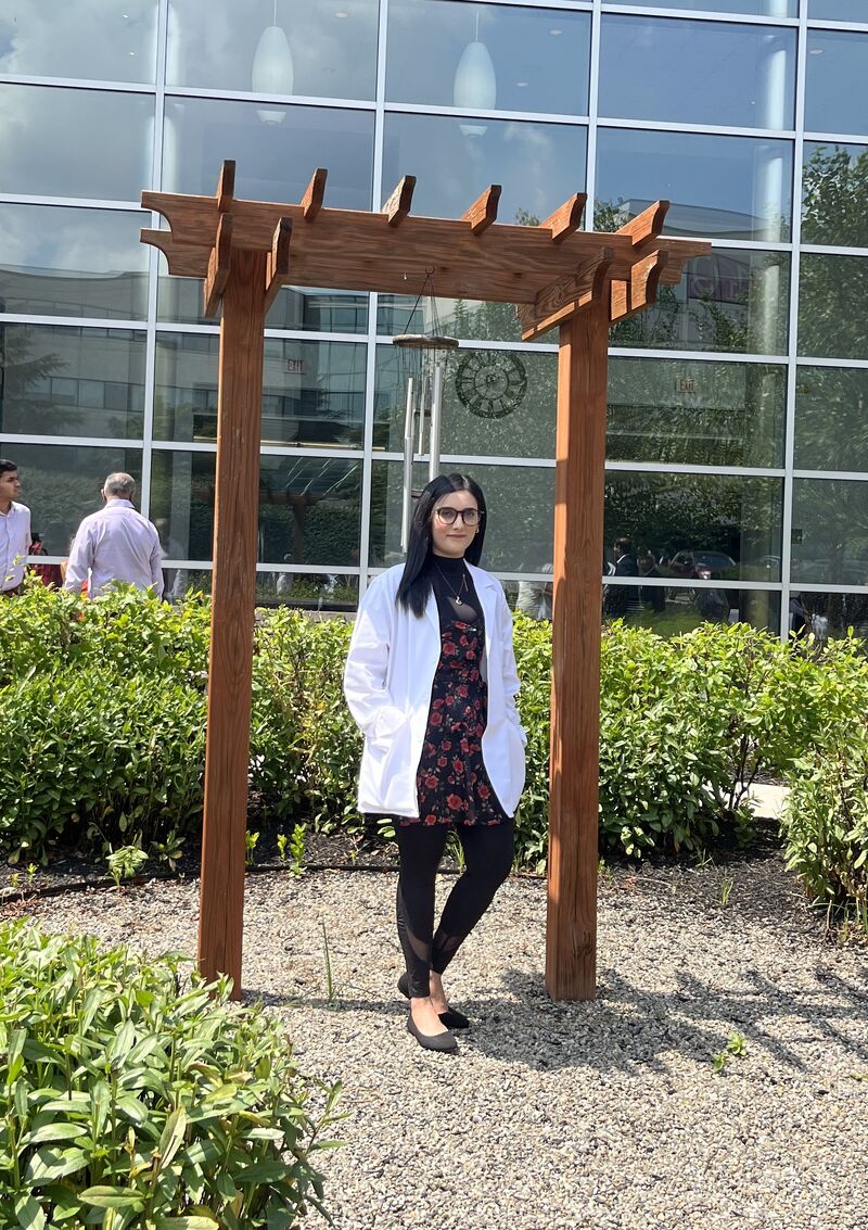 student wearing white coat