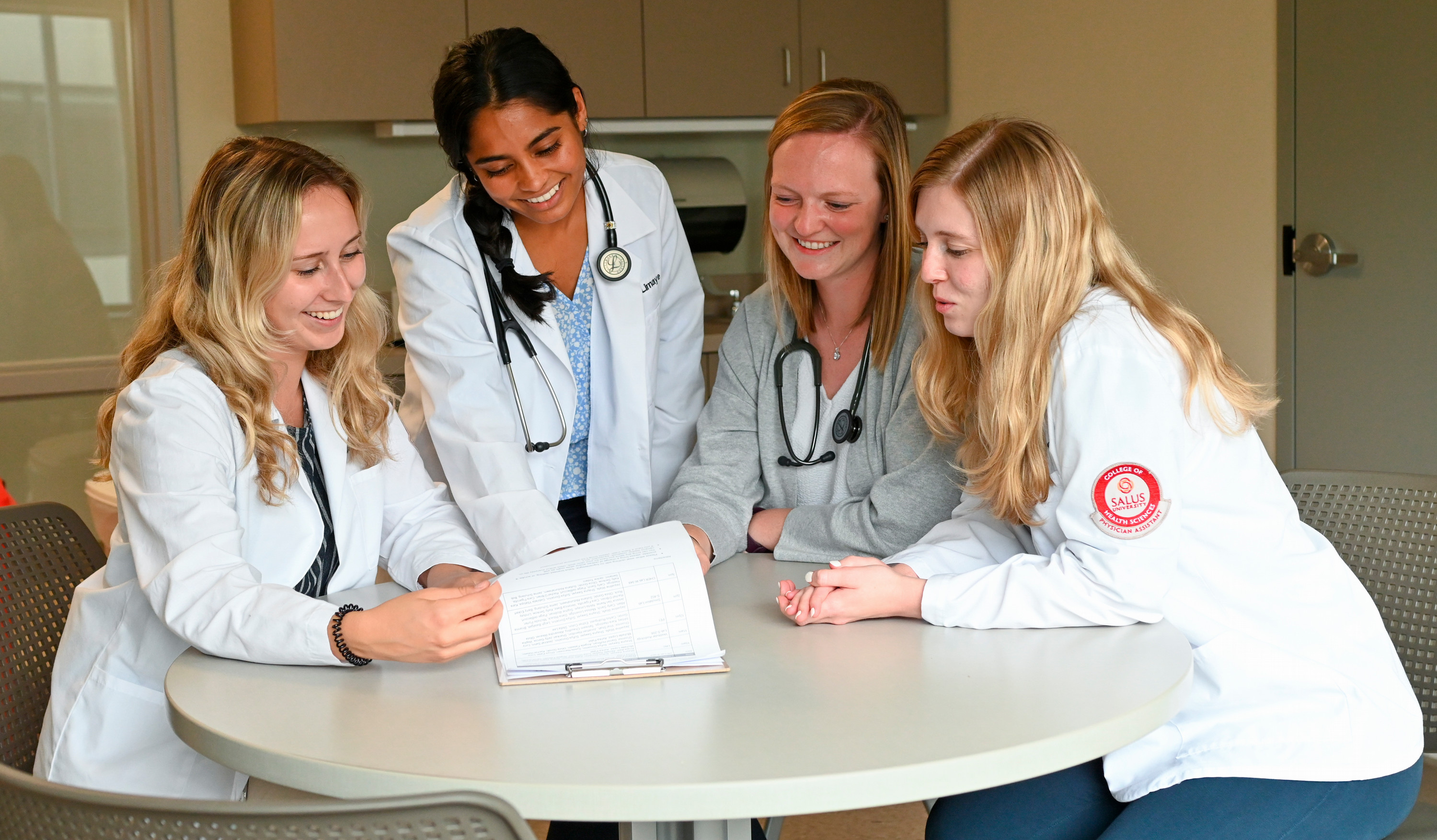 PA students in white coats