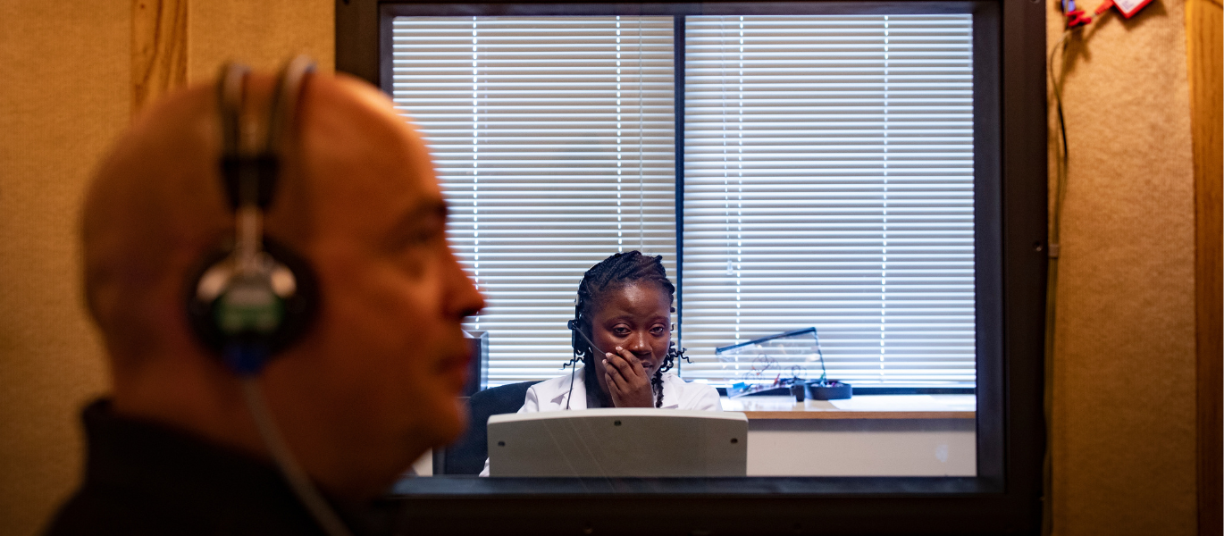 audiology student conducting hearing exam