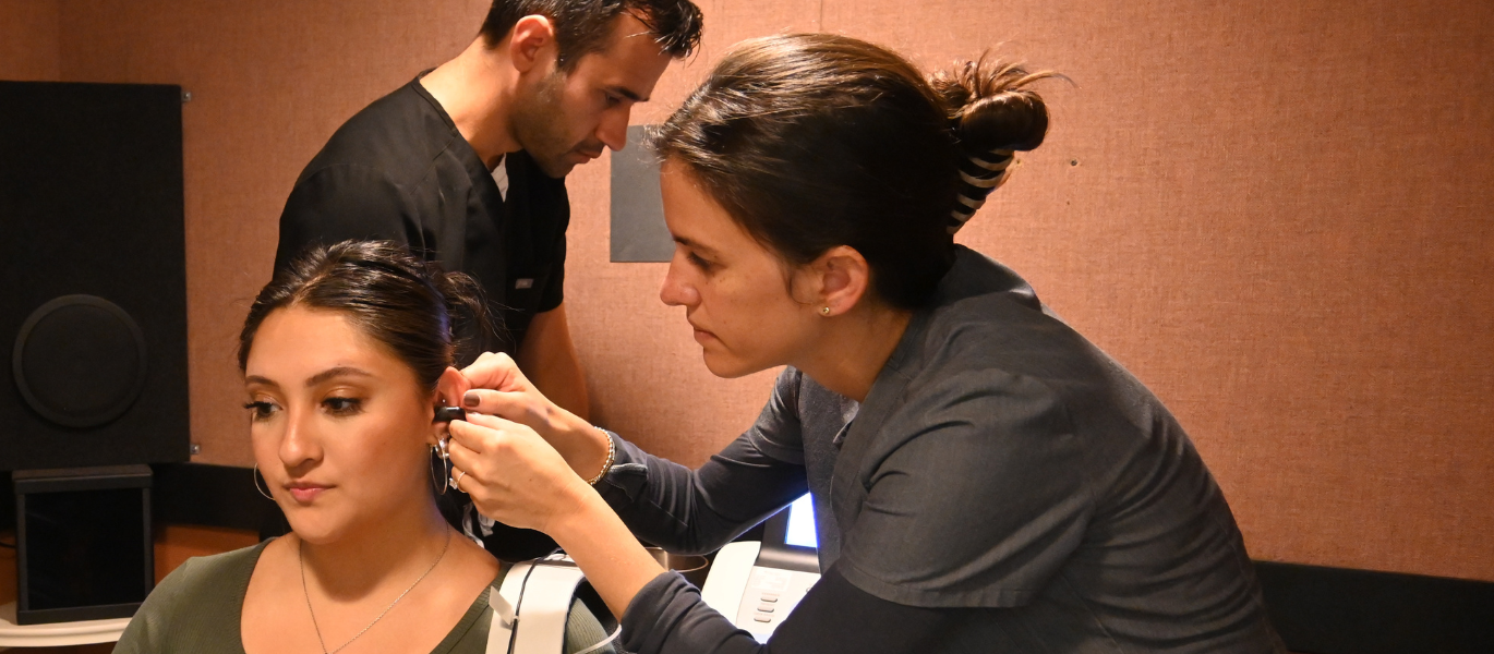 audiology student conducting hearing exam