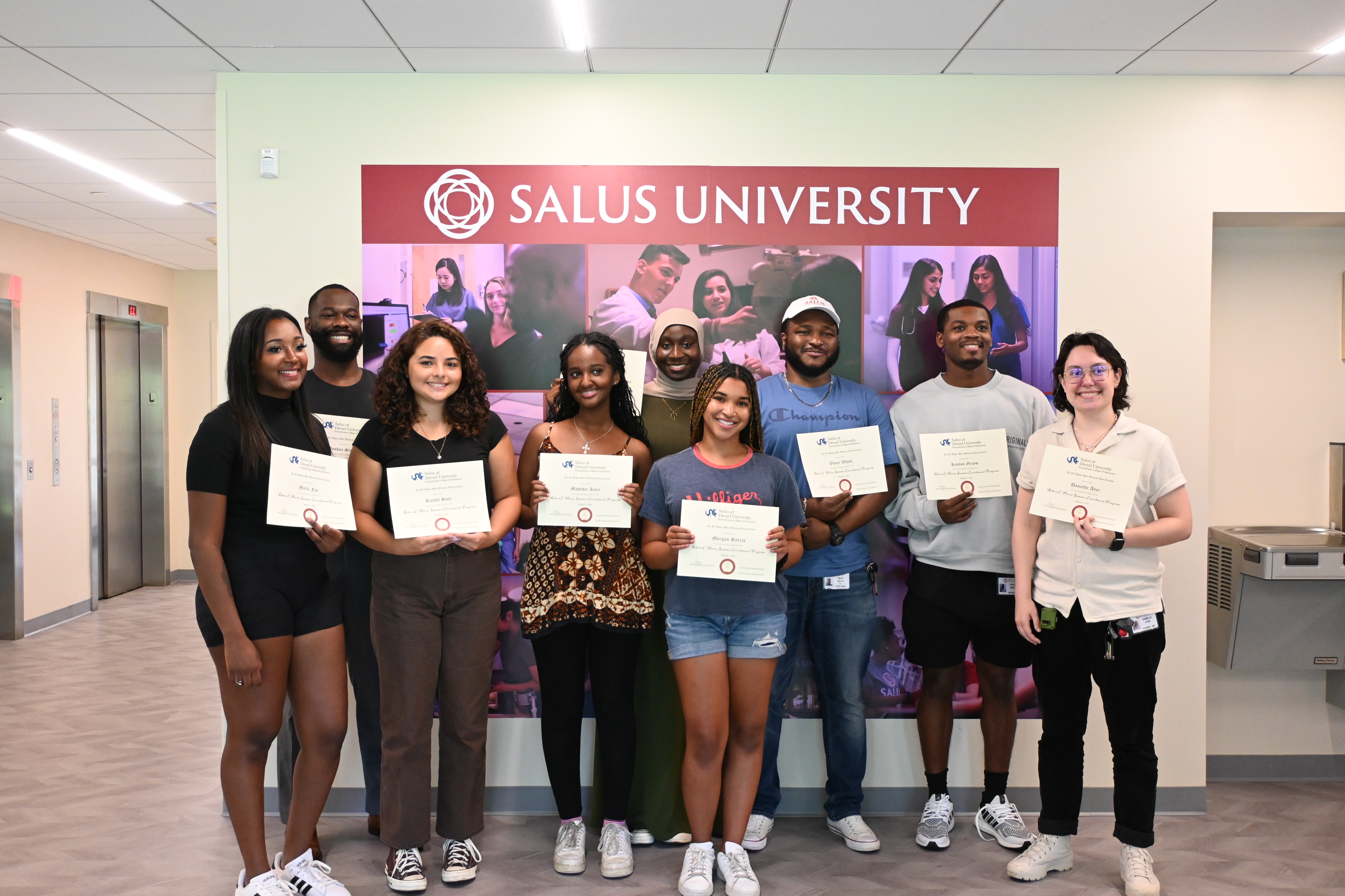 SEP students holding certificates