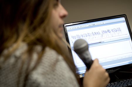 patient holding a microphone