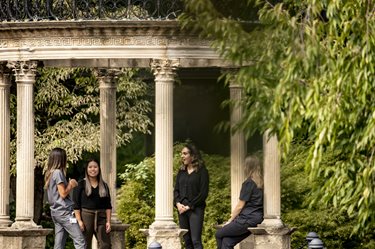 students standing gazebo outside of salus