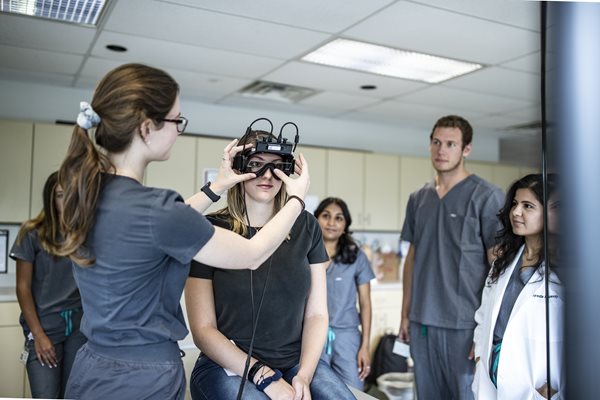 students working with audiology equipment