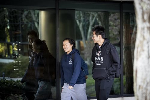 Students walking around the Salus Campus