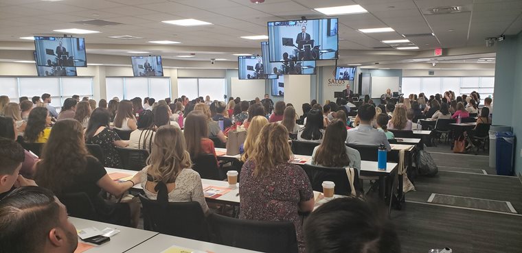 Dr. Mittelman speaking to new students 