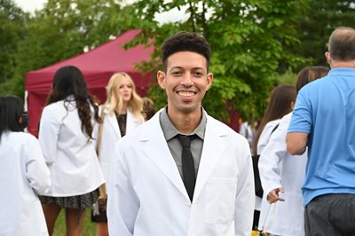 Aaron Brown wearing white coat