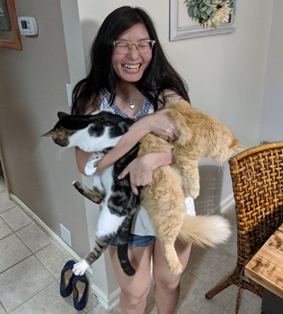 Ariella Erin Poon with her cats