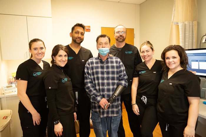 The Atlantic hand therapy team standing and smiling for a group photo