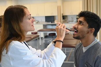 PA student examining patient