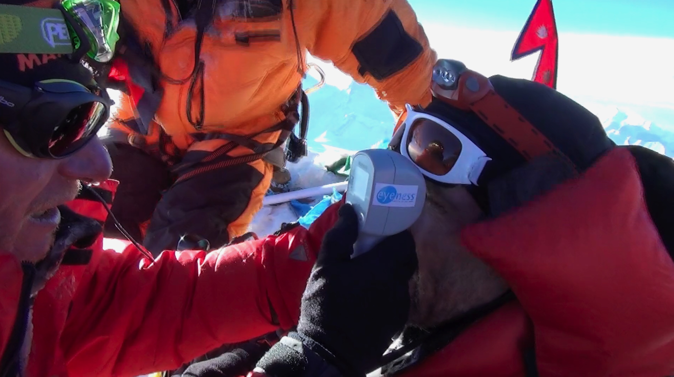 Dr. Michael Baertschi examines a patient on Mount Everest