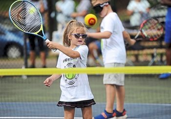 girl playing tennis