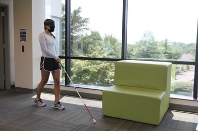 BLVS student walking with a white cane