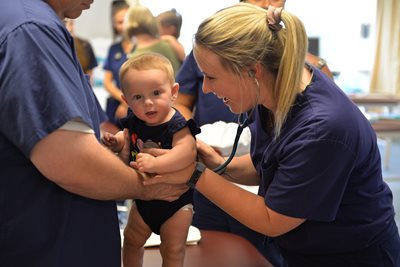 Physician assistant students with pediatric patient