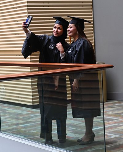 Grads taking a selfie together