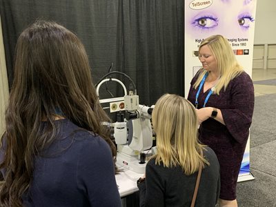 Dr. Coyne speaking with students