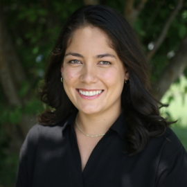 Denise Diaz headshot standing outside in a black shirt