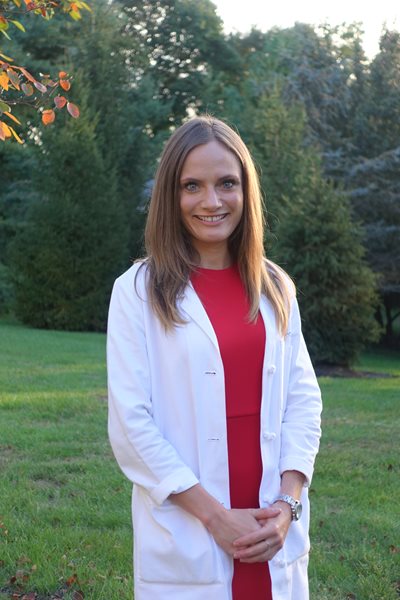 PA student wearing long white coat