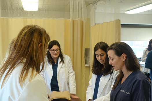 Rachel Ditoro with PA students in lab