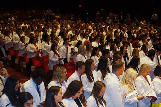 students at white coat ceremony