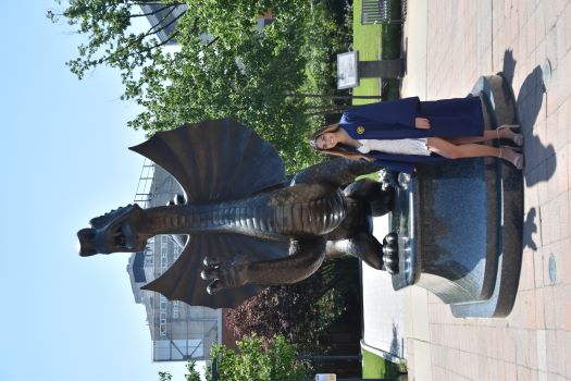 Emily standing in front of the Drexel dragon