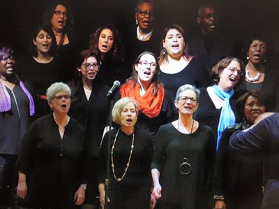 Emily Vasile performing in a choir