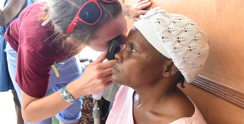 SOSH student performing eye exam