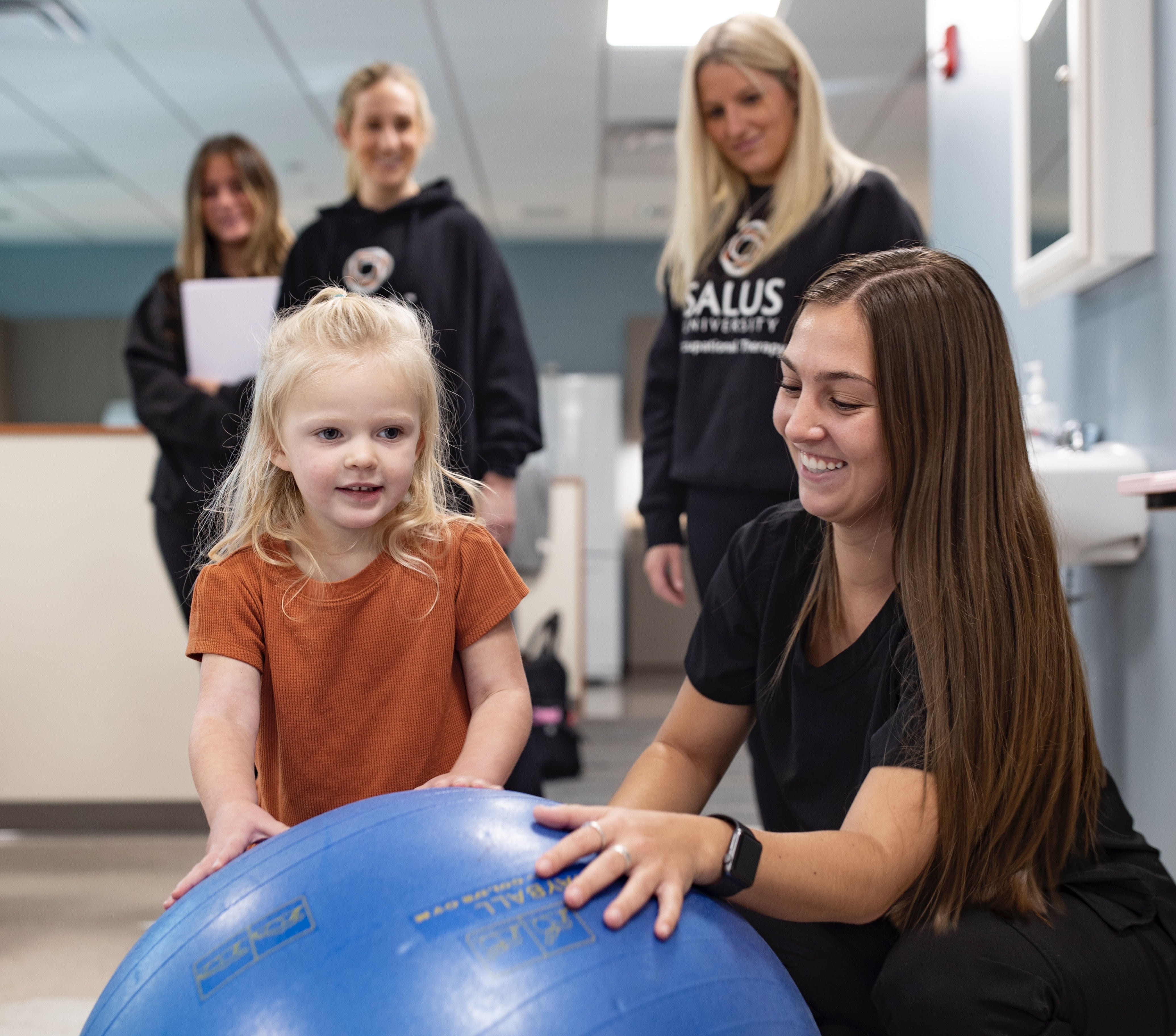 Occupational therapists working with a pediatric female client