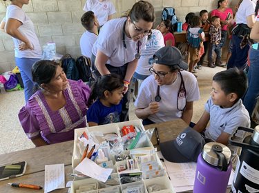 student working with young patients