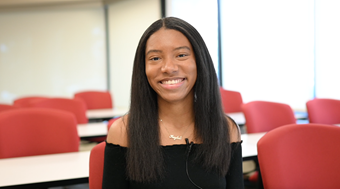 Student Kaylea Ellison show smiling in well-lit Salus classroom.